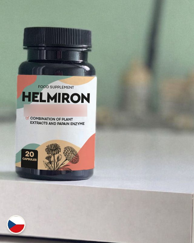 Lahvička Helmiron na bílé komodě